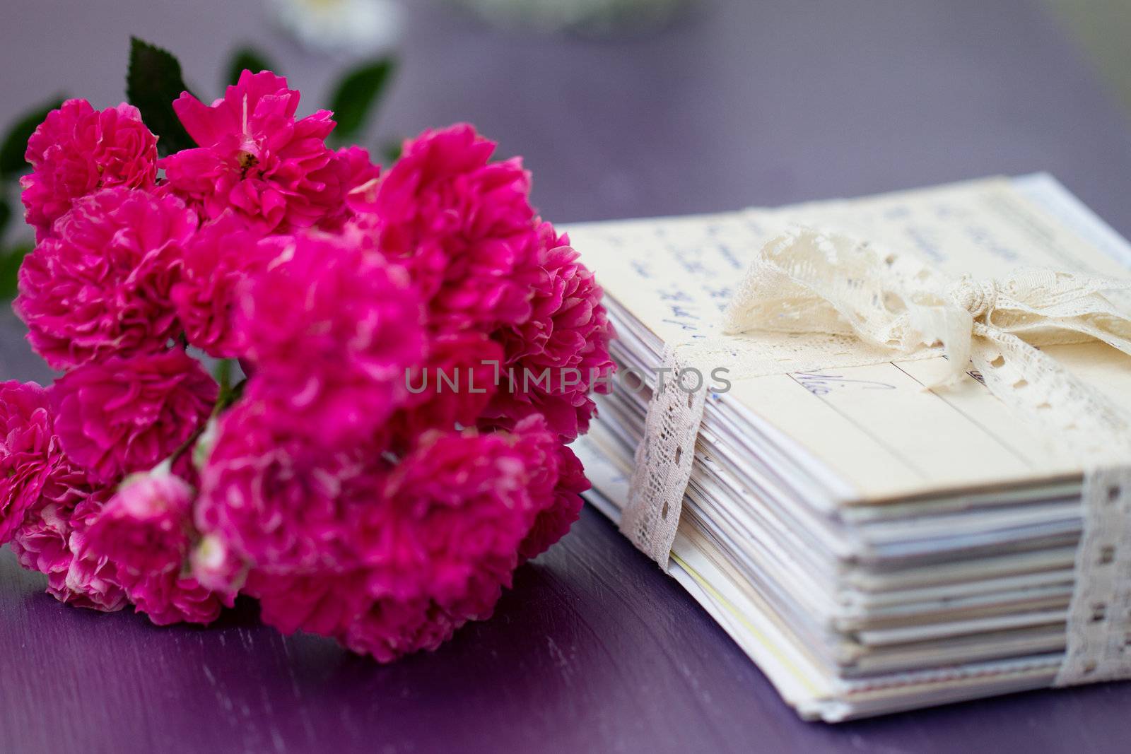 stack of old letters with roses by victosha