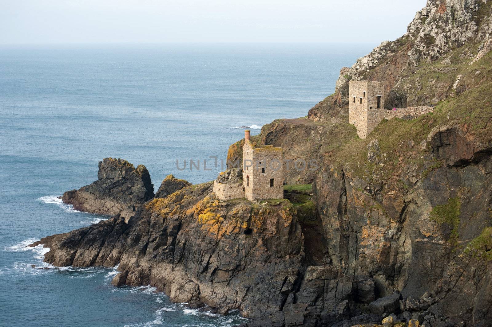 Crown Mines ruins, Botallack, Cornwall, with the remnants of the two stone engine houses perched on the cliffs overlooking the Atlantic ocean