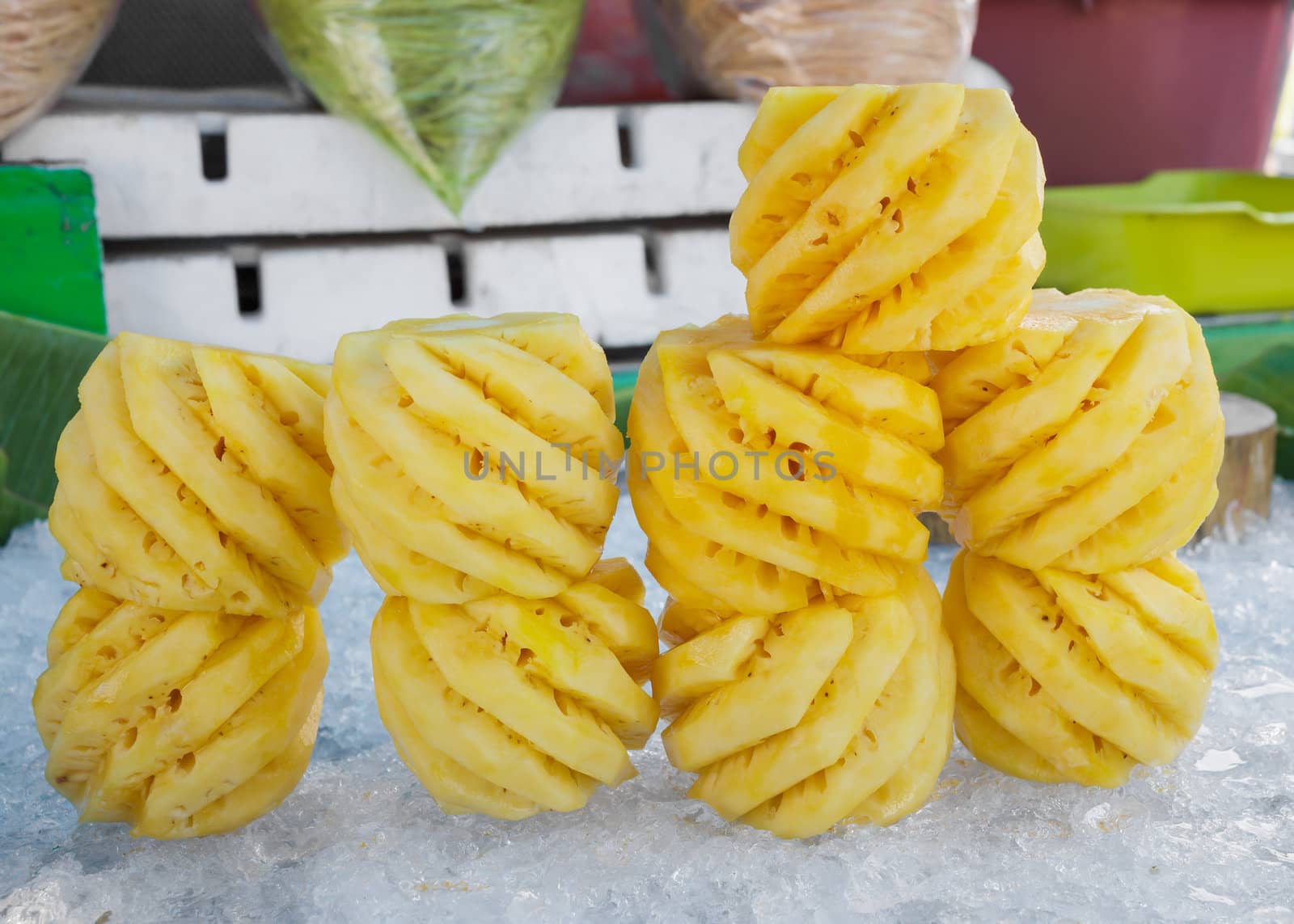 Pile of pineapples slices stack on ice