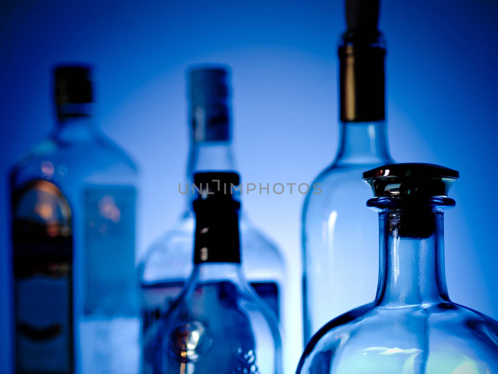 Bottles at a bar by Alex_L