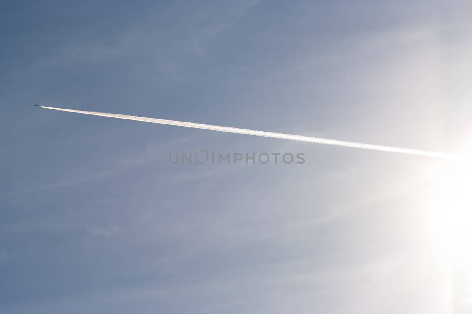 Shot of the flying air plane on blue sky