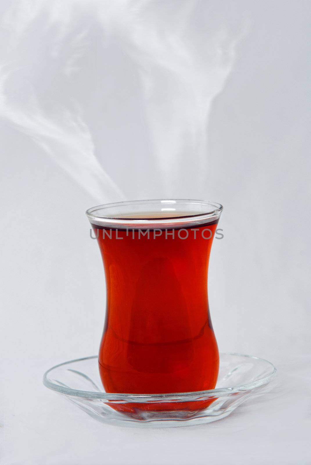 Turkish tea in traditional glass isolated on white side view