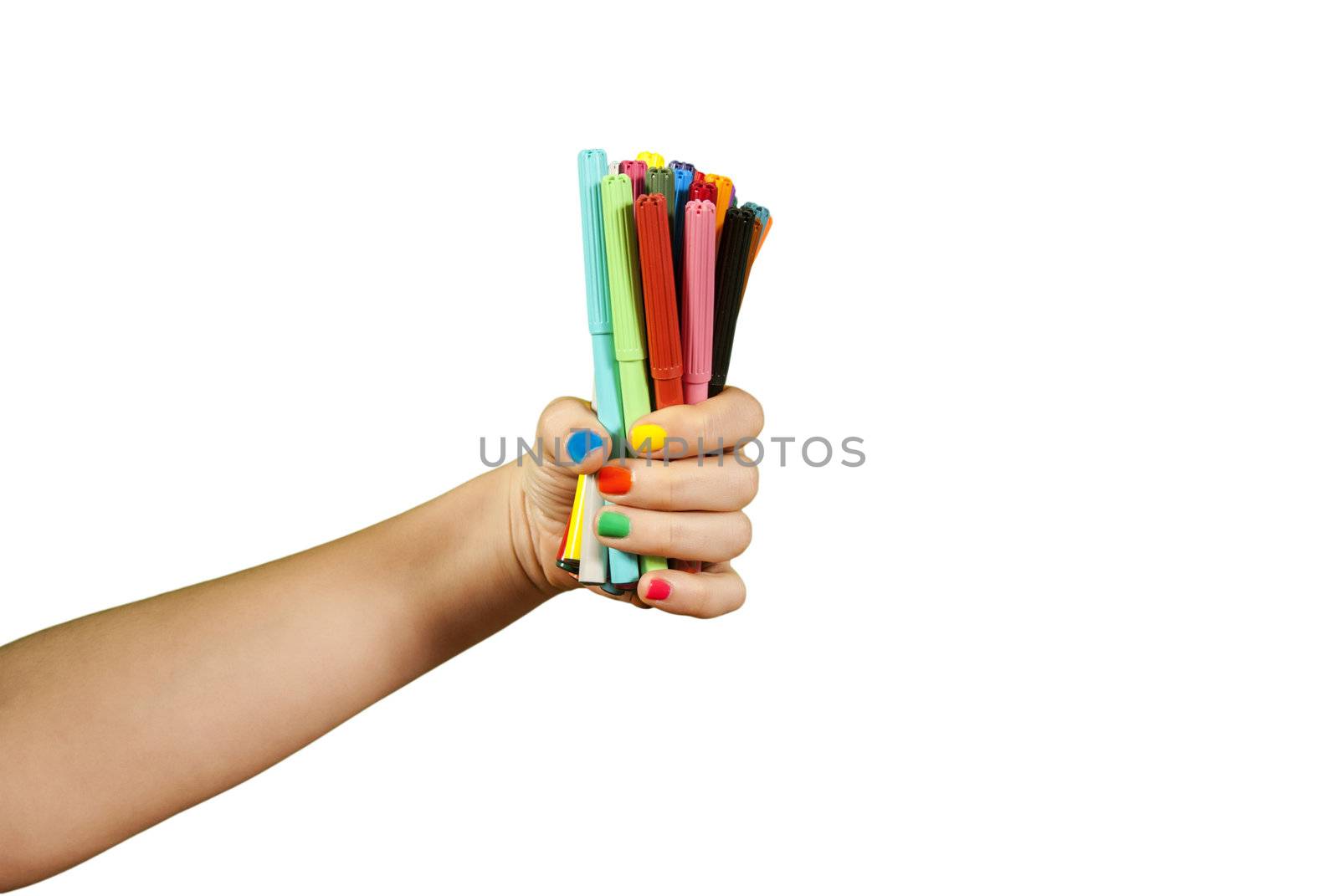 Colorful markers in hand, isolated on white.