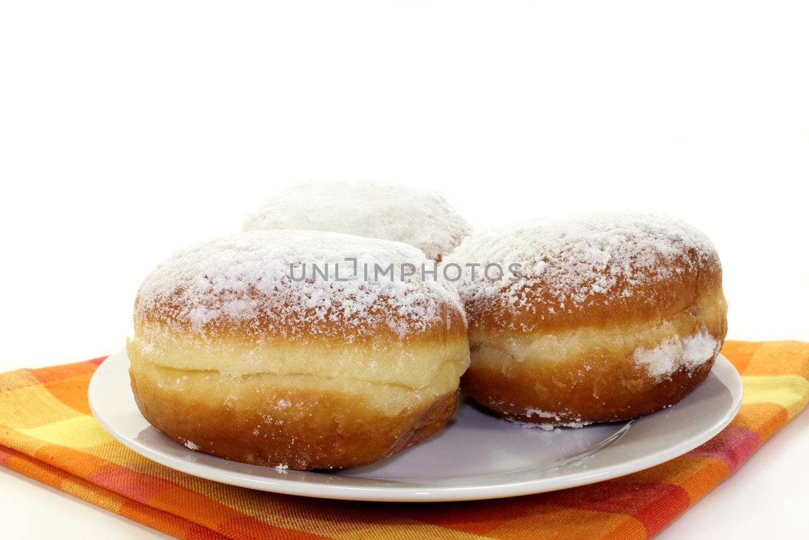 a plate of donuts on a white background