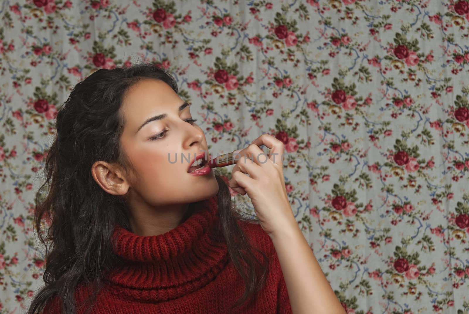 Woman with lipstick with floral background
