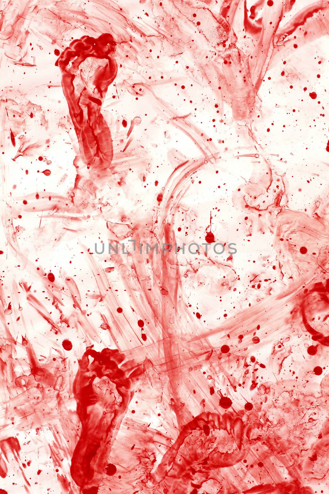 Photo of a mess of blood splatters, droplets, footprints and smears.
