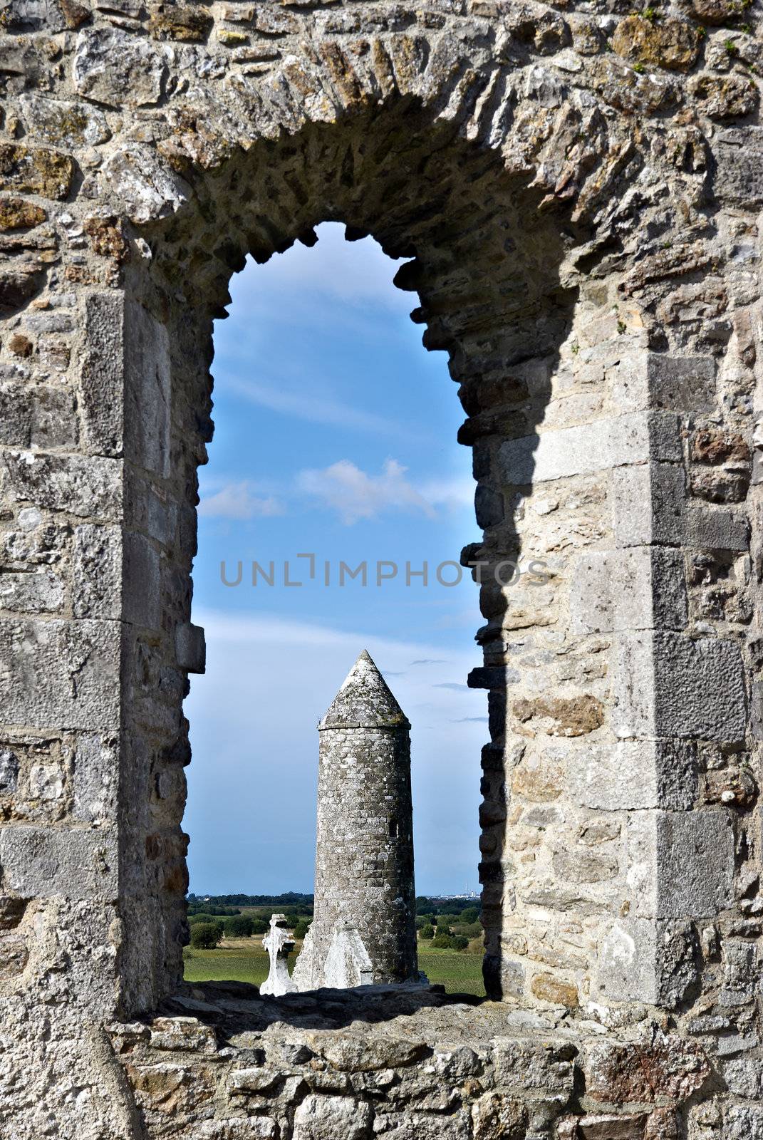 The monastery of Clonmacnoise, Ireland - McCarthy's Tower thru a window of the cathedral