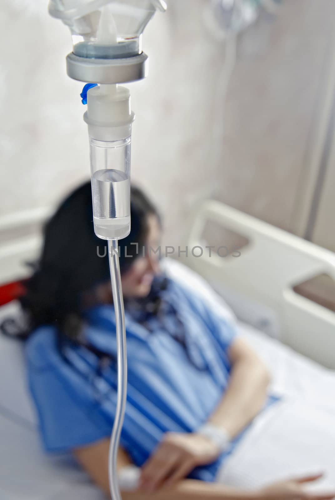 Woman in hospital bed
