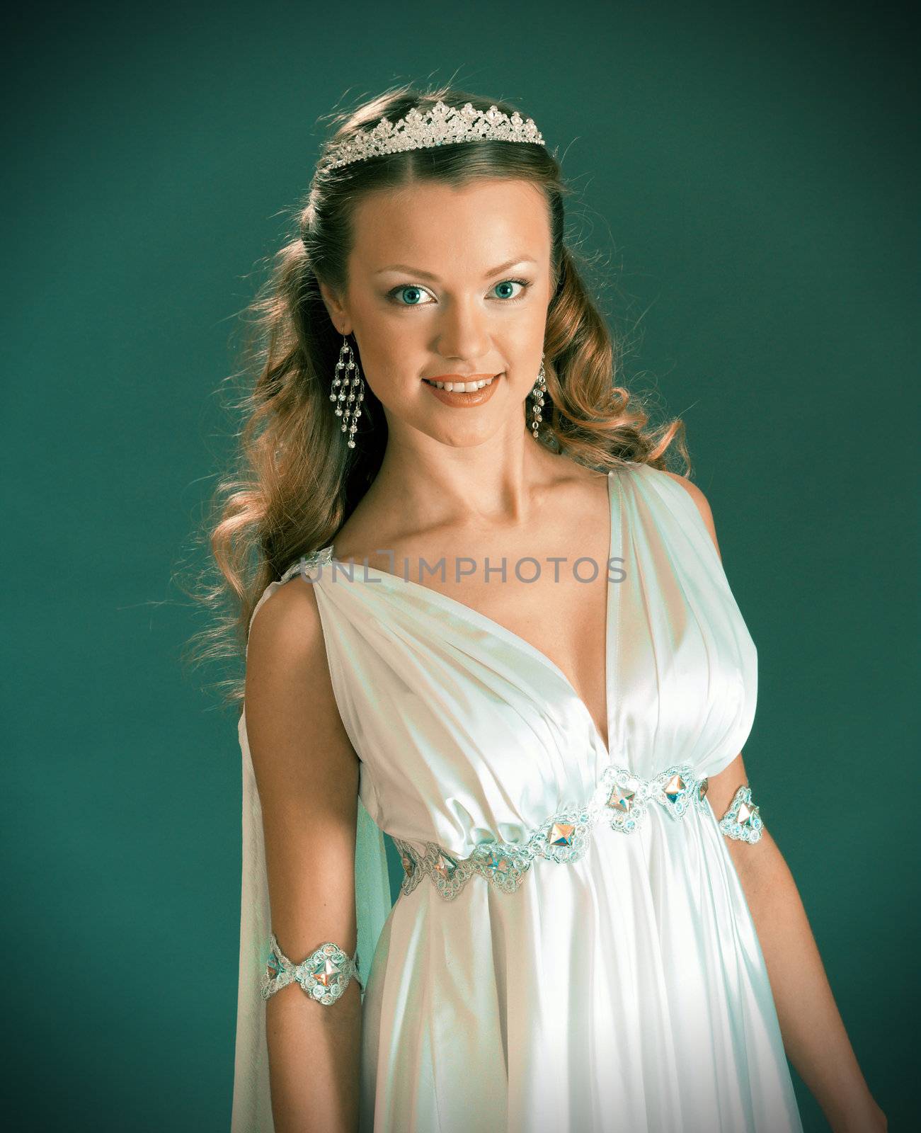 Beautiful young female wearing white dress in antique style  .Like goddess