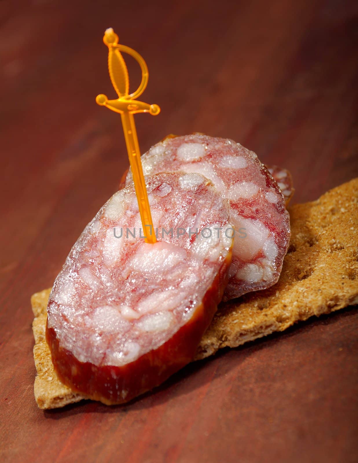 Salami and bread. close up with washed away by back background