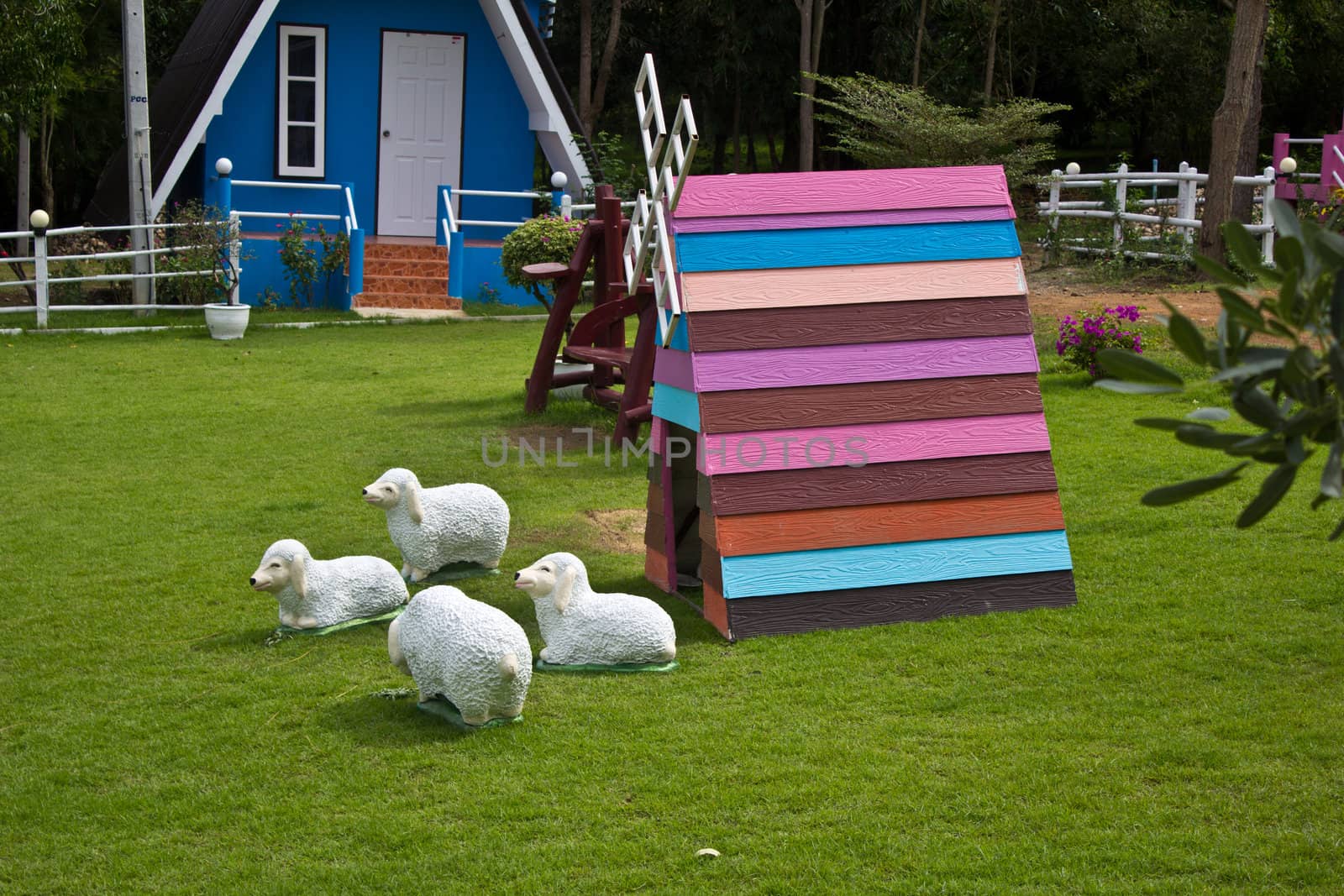 wooden windmill with sheep