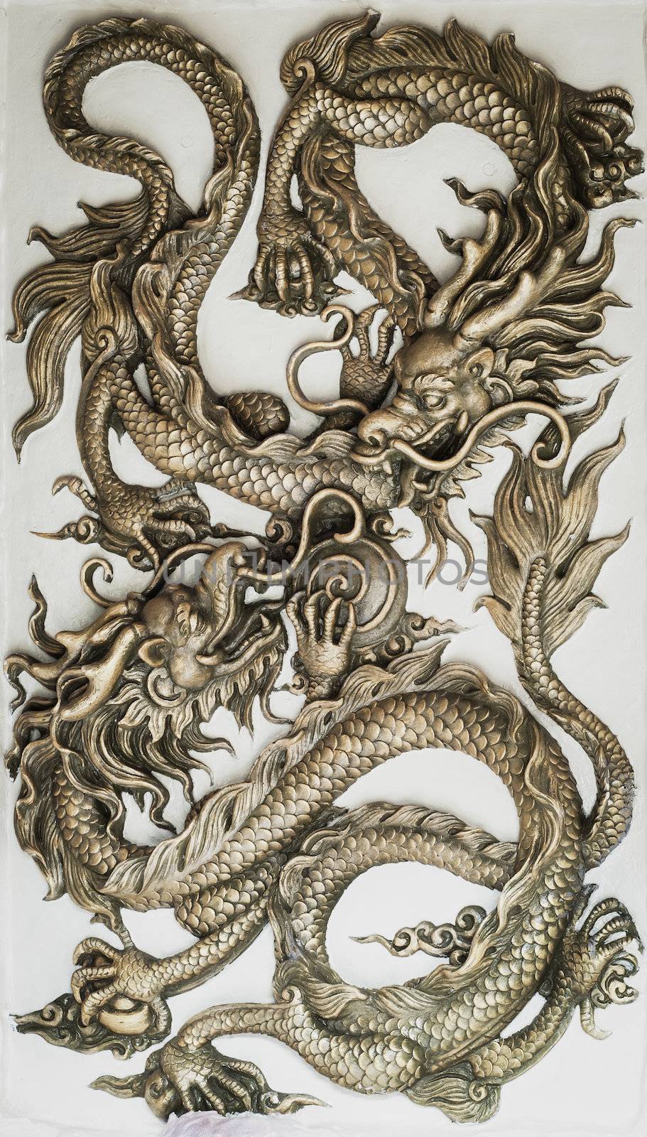 Dragon sculpture on wall  by FrameAngel