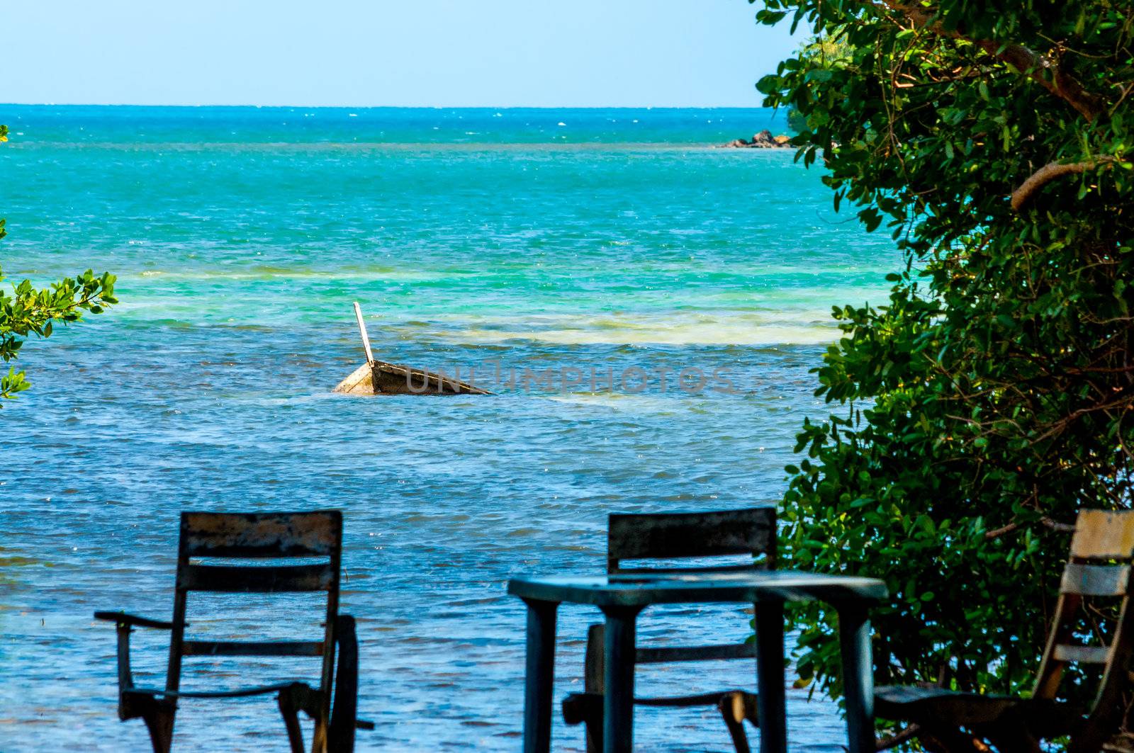 Sunken boat with chairs in San Andres y Providencia, Colombia
