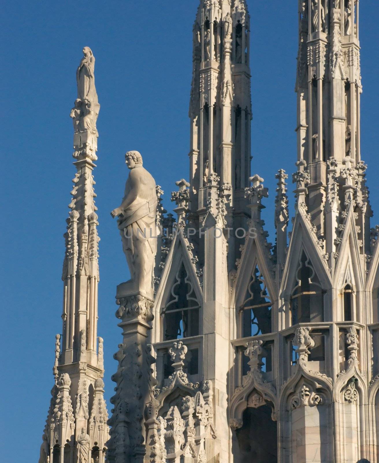 Statues of the Duomo cathedral in Milan in the evening