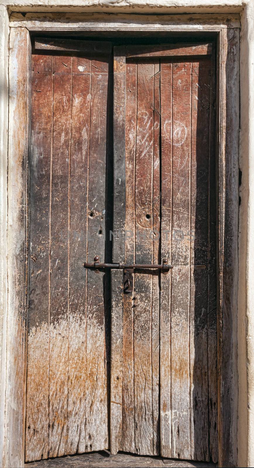 Old dilapidated wooden door. Rajasthan, India