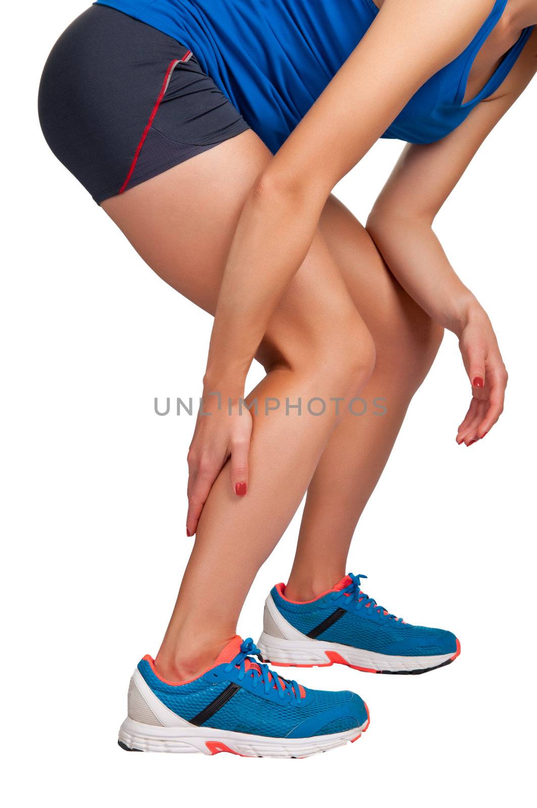 Female jogger with pain in her lower leg, isolated in white