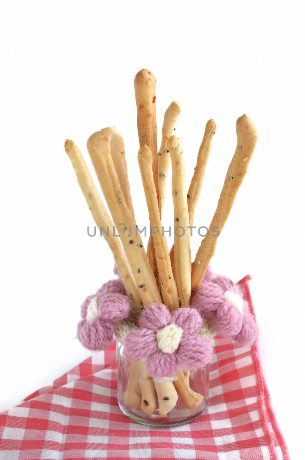 bread sticks in glass bottle