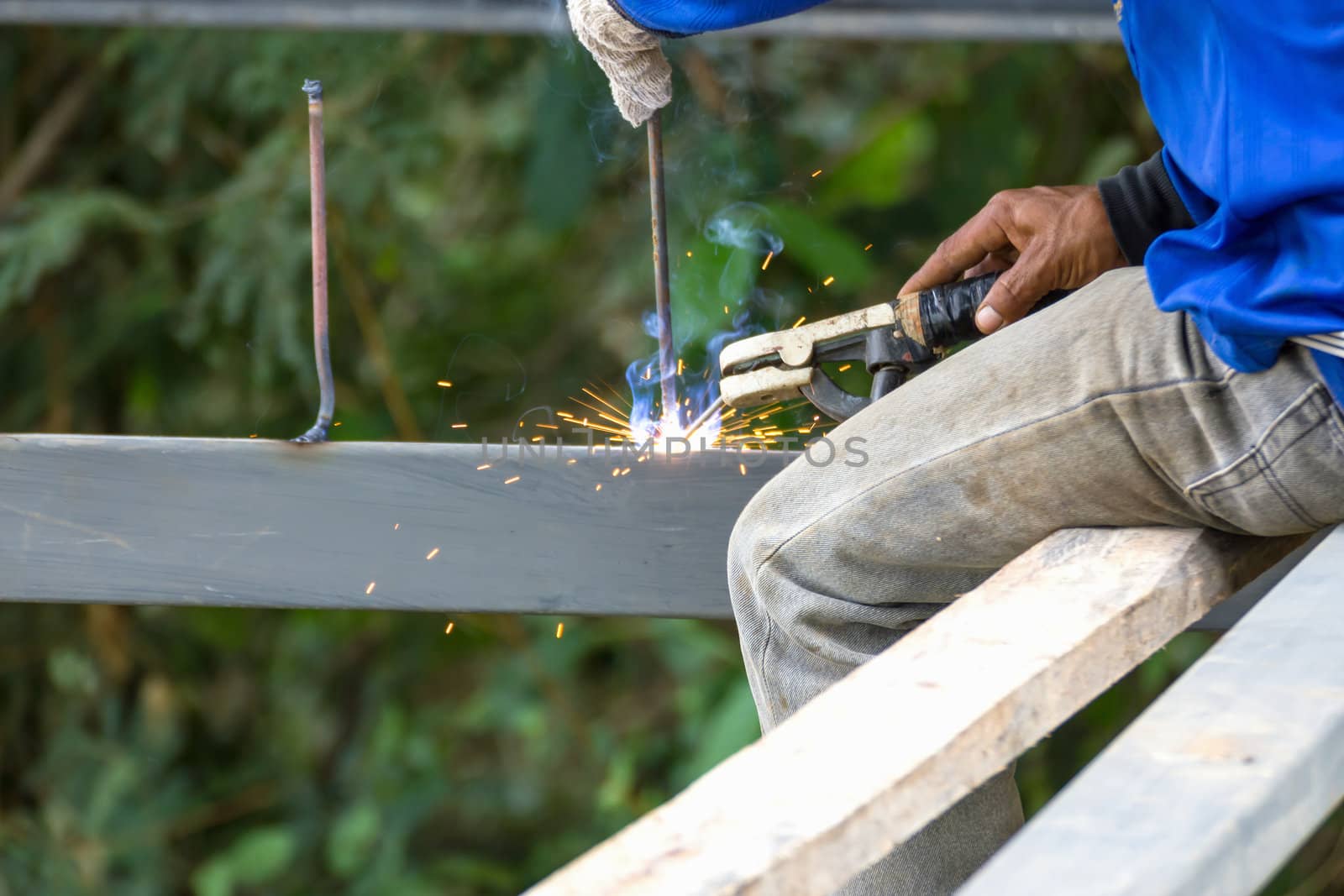 Welder welding  elements at the  construction site