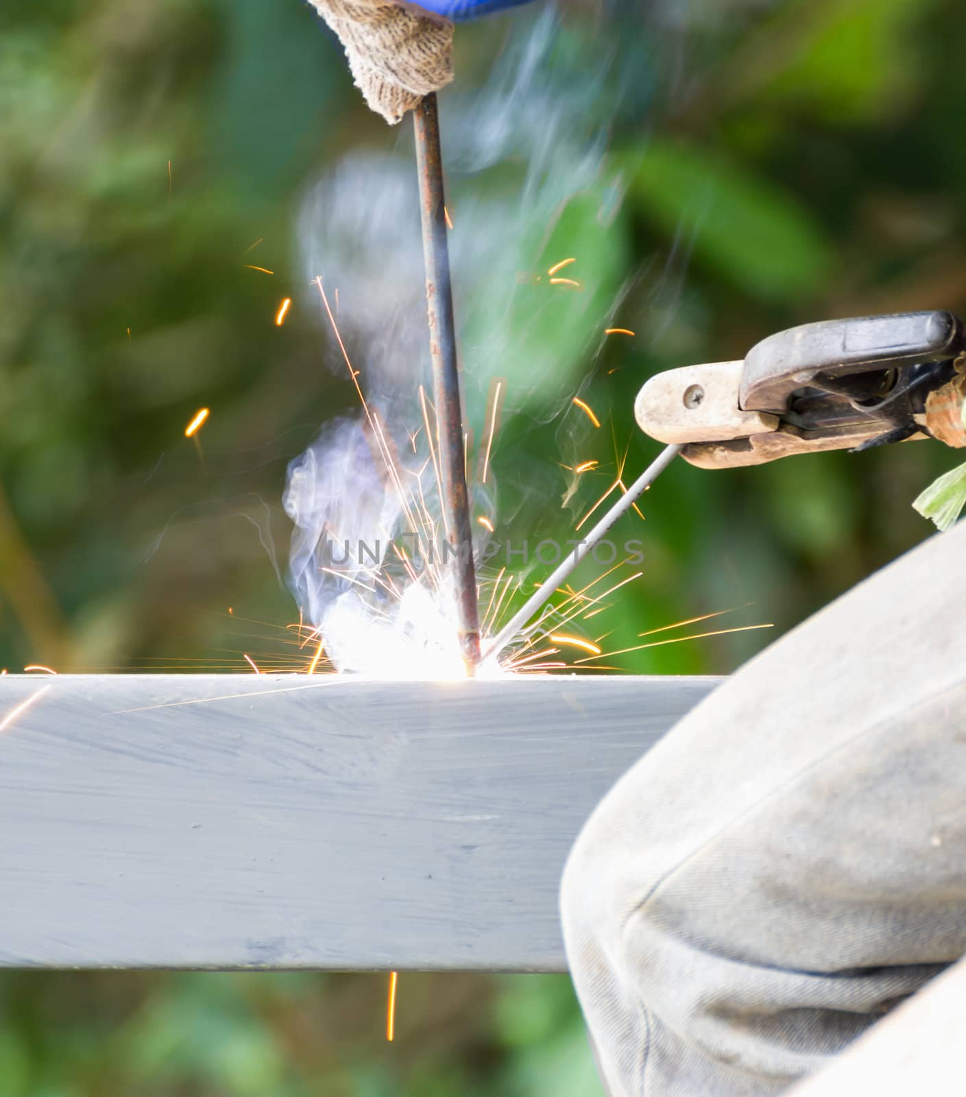 Welder welding  elements at the  construction site