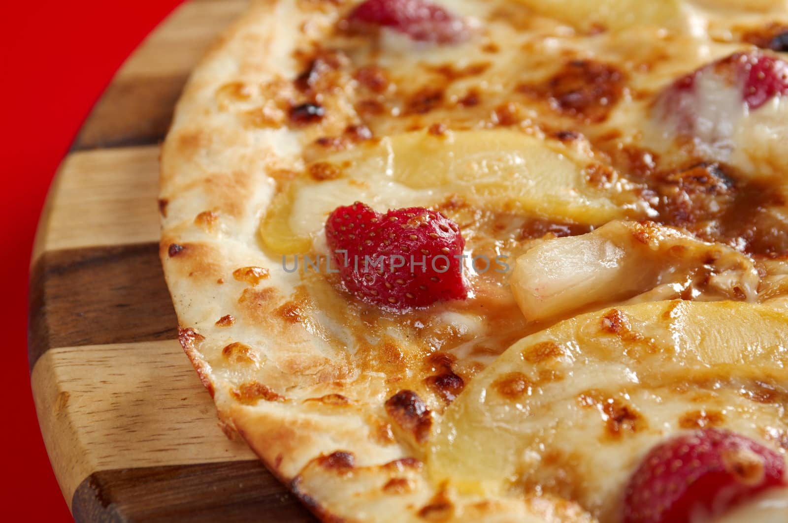 Pizzasweet with strawberries. italian kitchen. Studio