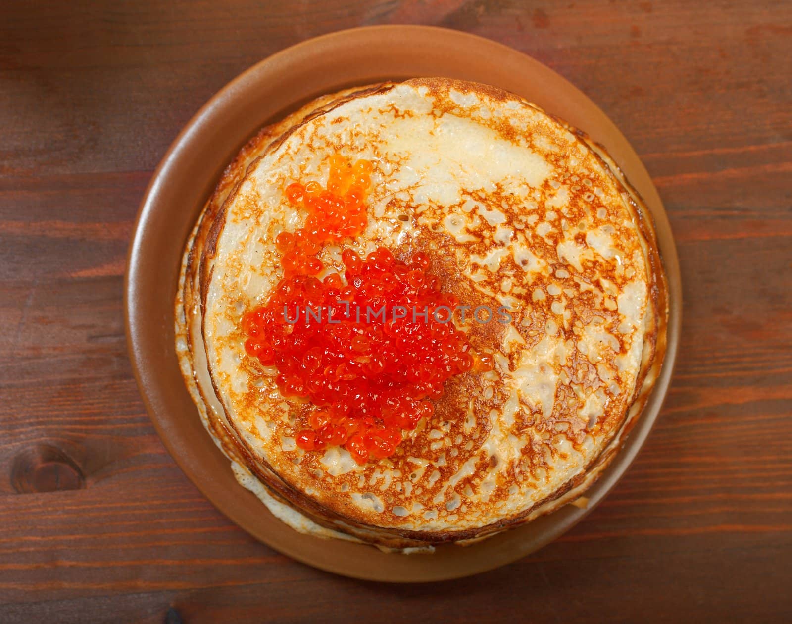 Traditional Russian pancakes  with red caviar