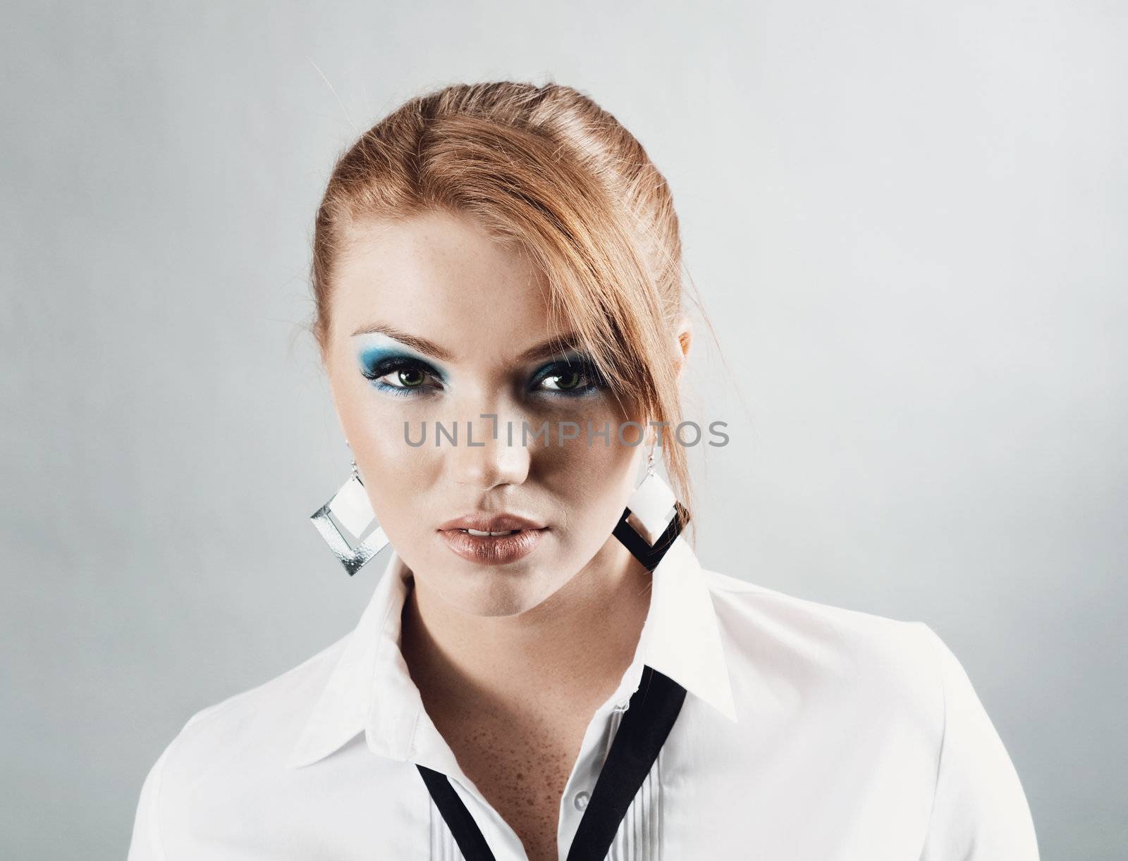 redheaded girl  in formal dress like a secretary with white shirt and tie 