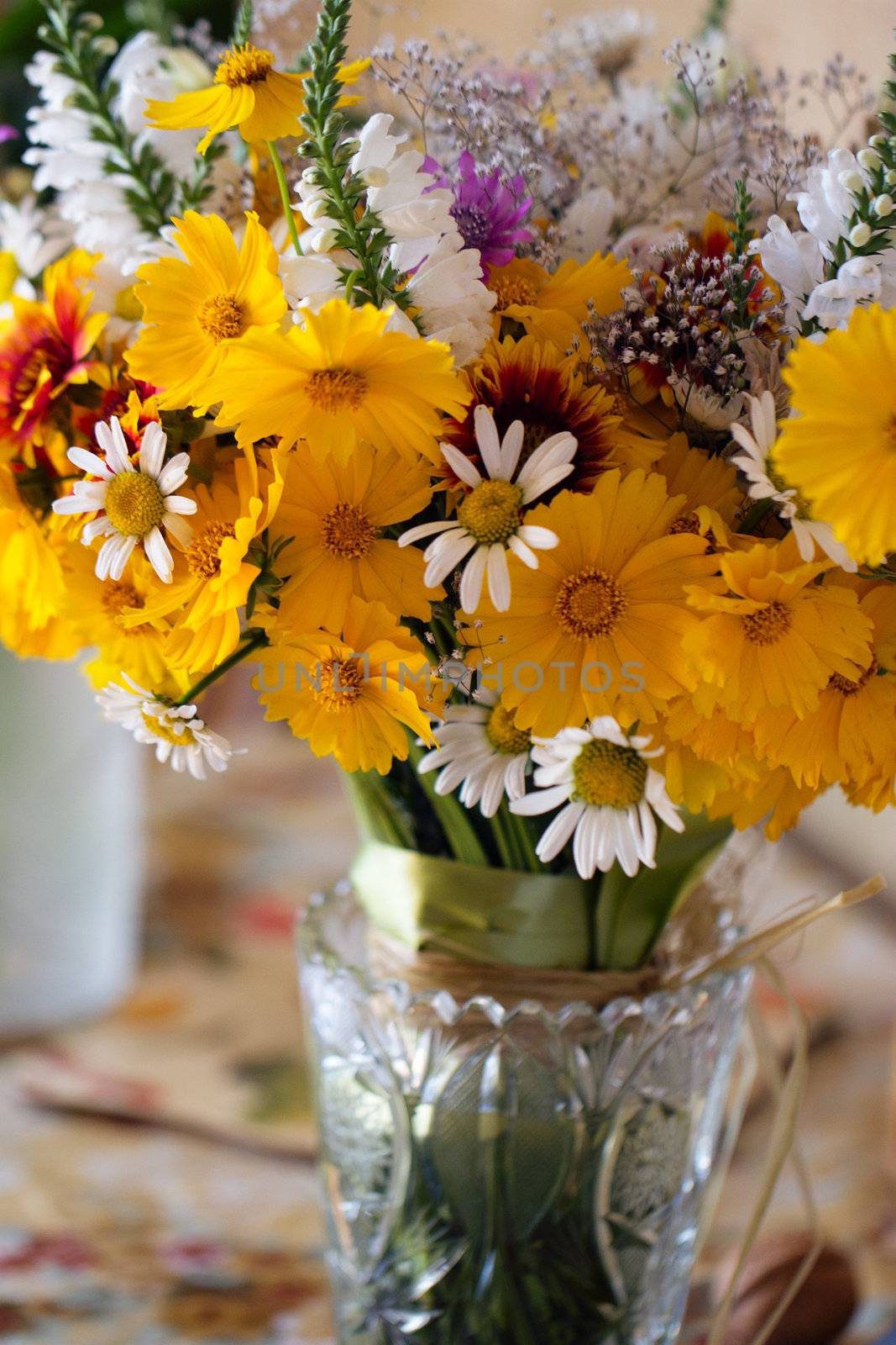 Beautiful bouquet of wild flowers in a purple bucket