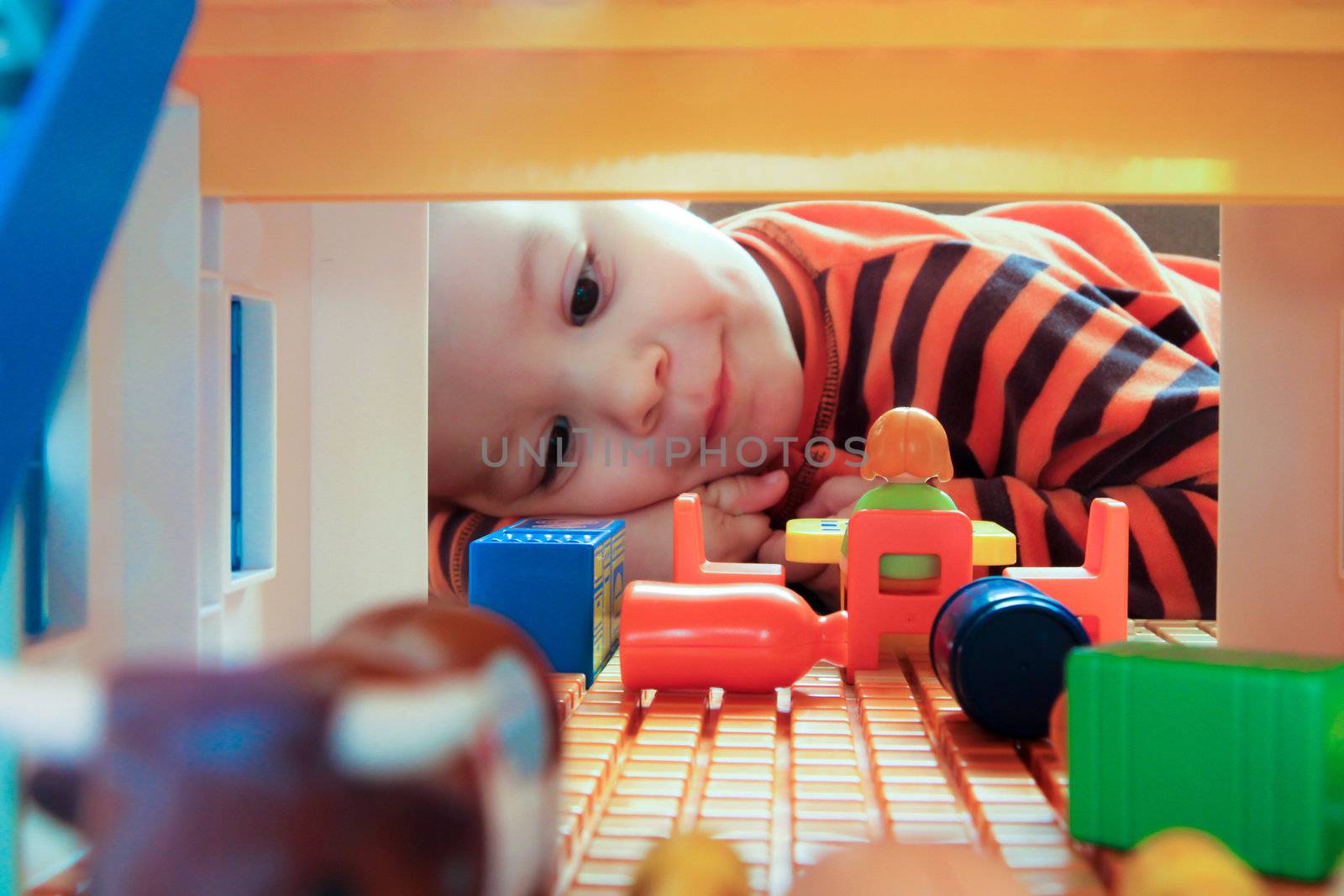 Child looking through toy farm by doble.d