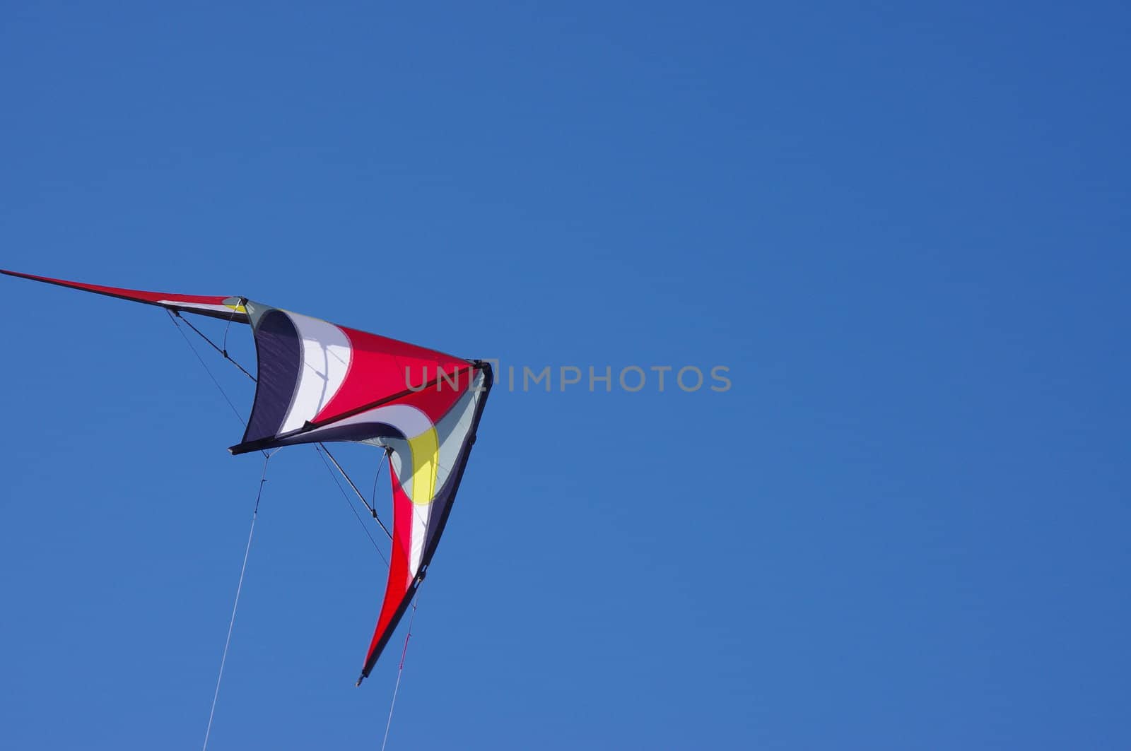 sport colorful stunt Kite in clear blue sky