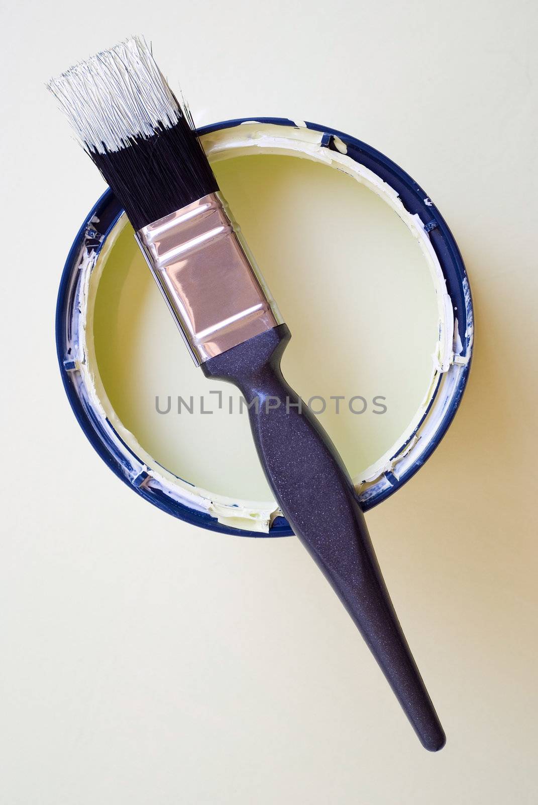 DIY home improvement paint brush on bucket or tin