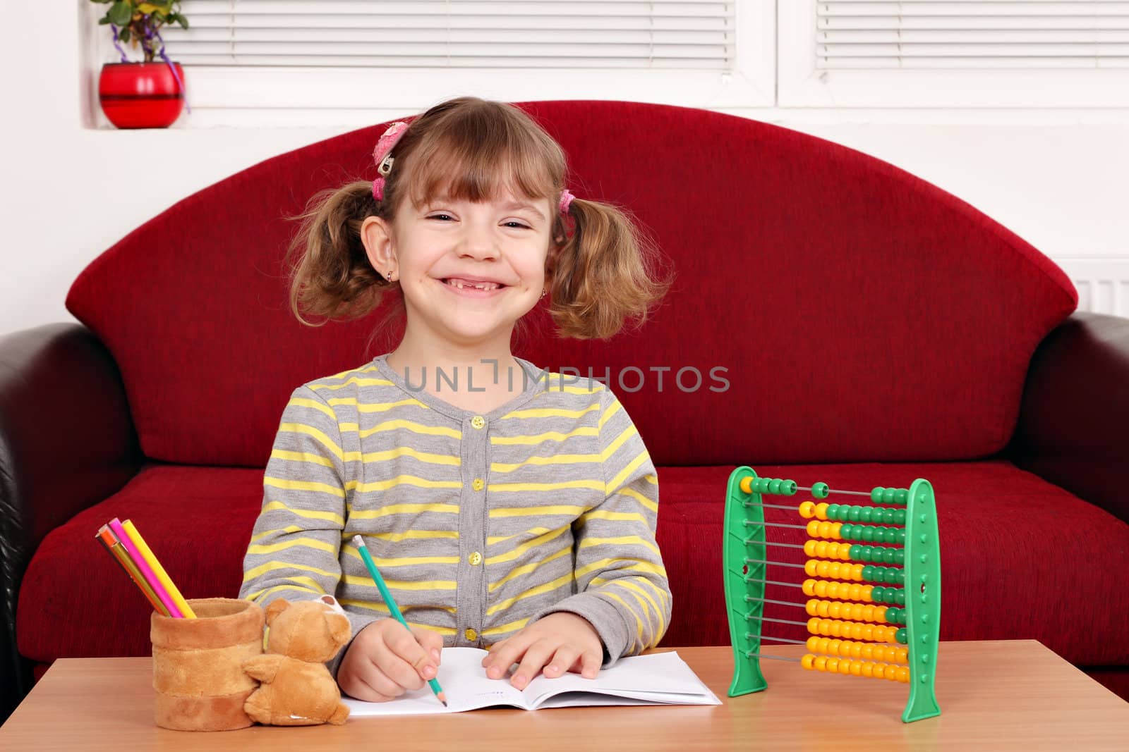 happy little girl school homework
