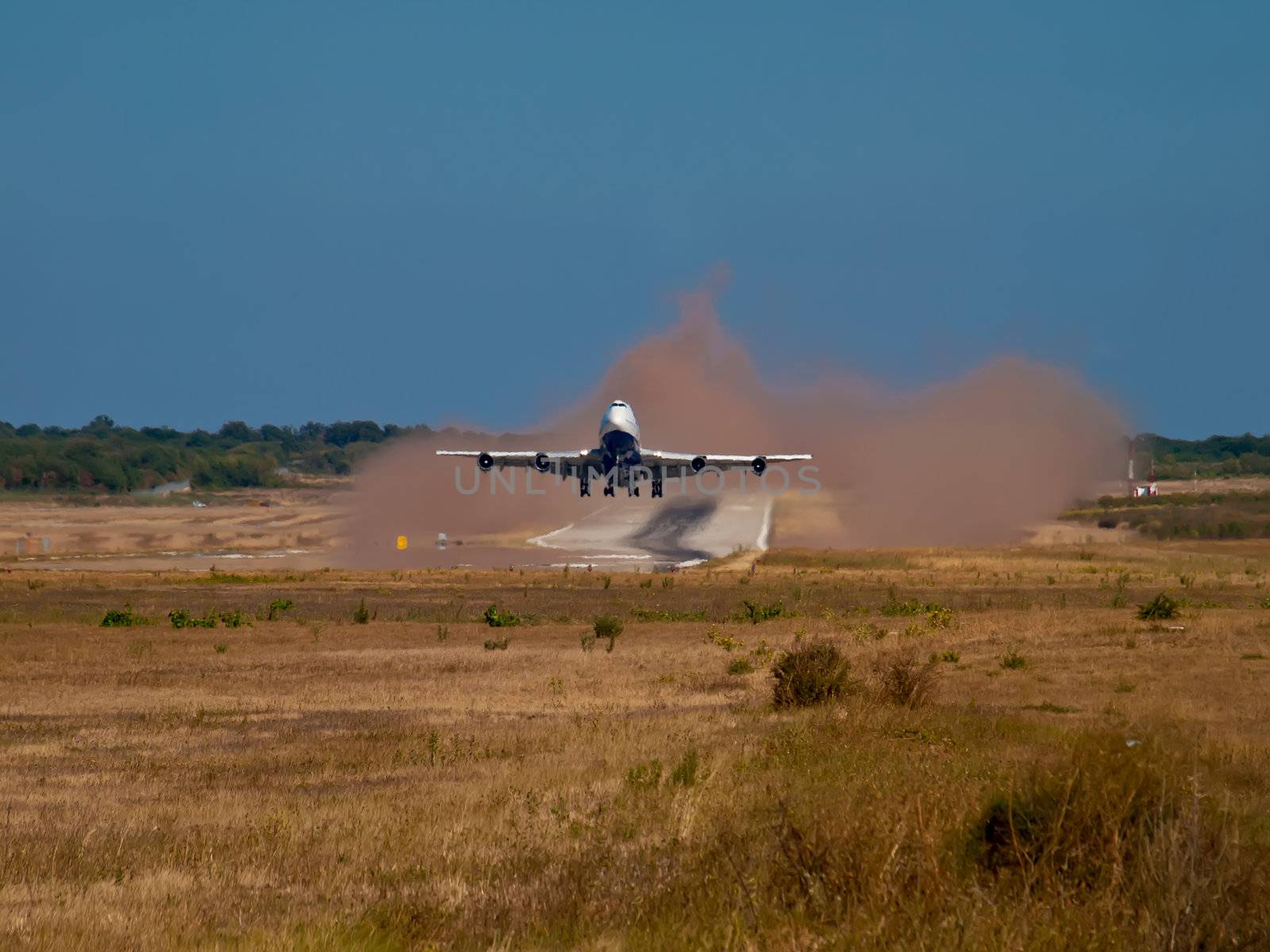 airplane takeoff and make a lot of dust
