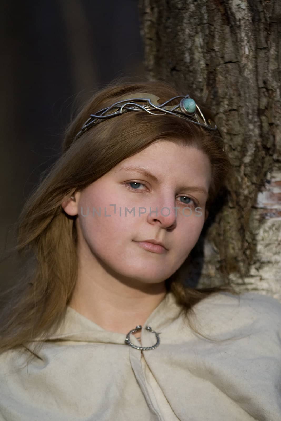 Portrait of the romantic girl in autumn forest