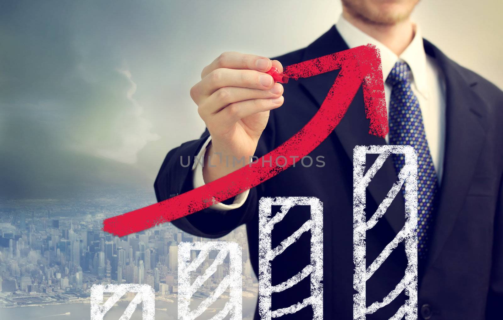 Businessman with graph representing growth above the city