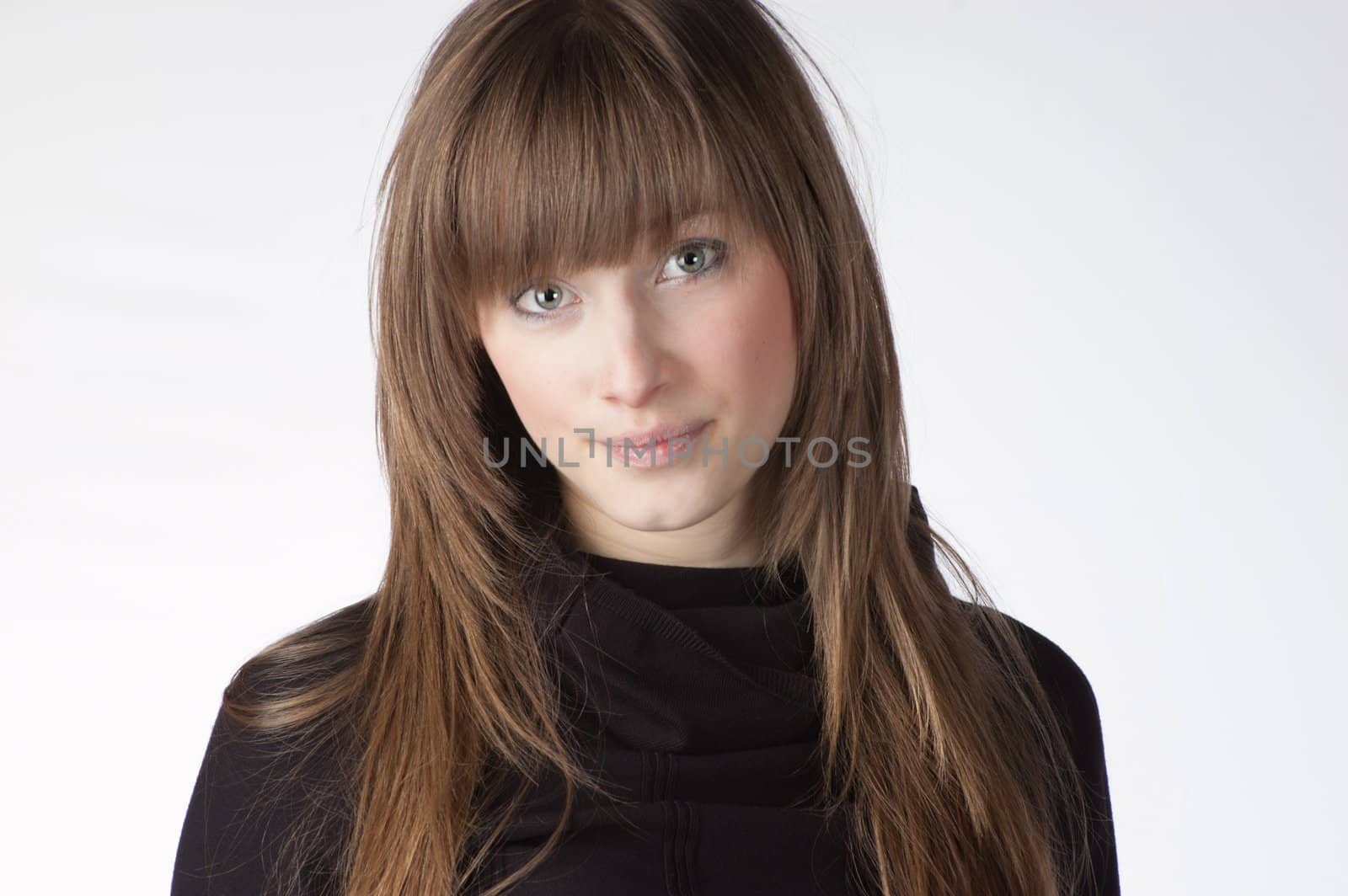 Head and shoulder portrait of smiling girl with blond hair isolated on white background.