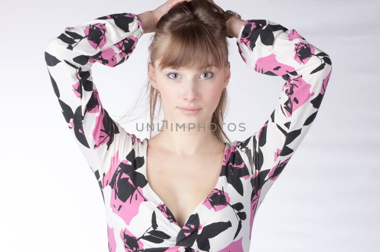 Young beautiful blond Caucasian girl on white background.