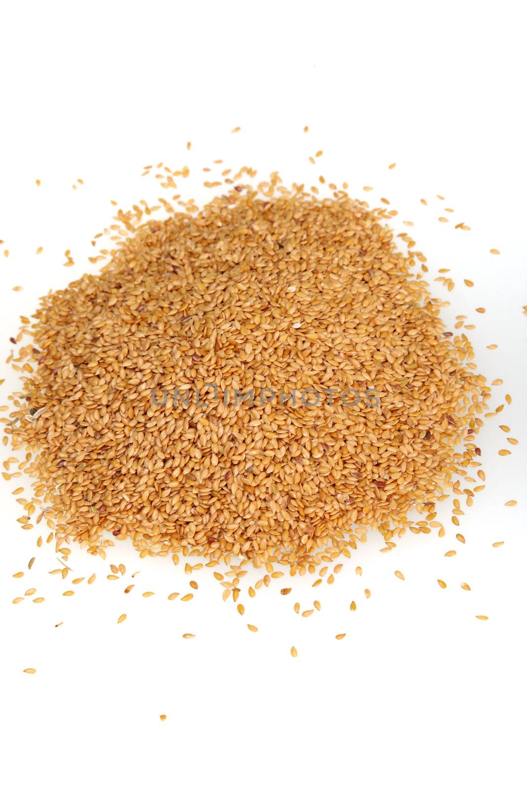 Image of linseed on white background. Image of yellow food grains on white background.