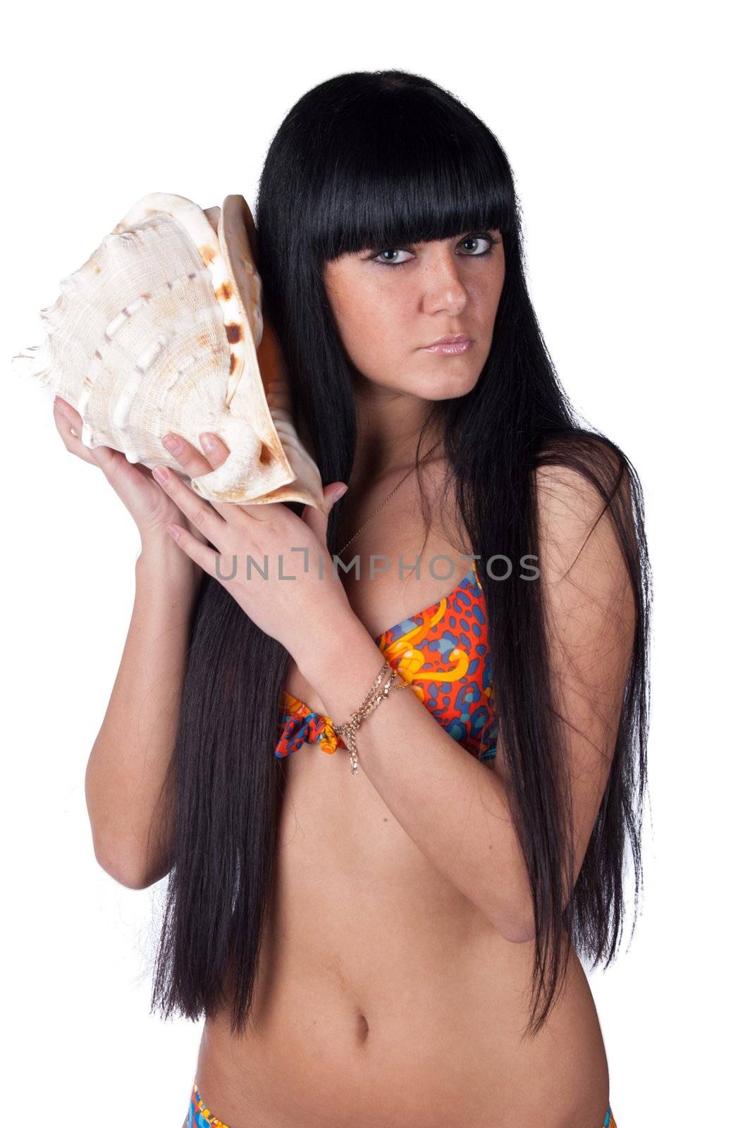 Beautiful young woman posing with marine shell. Spa, healthcare. Isolated over white.