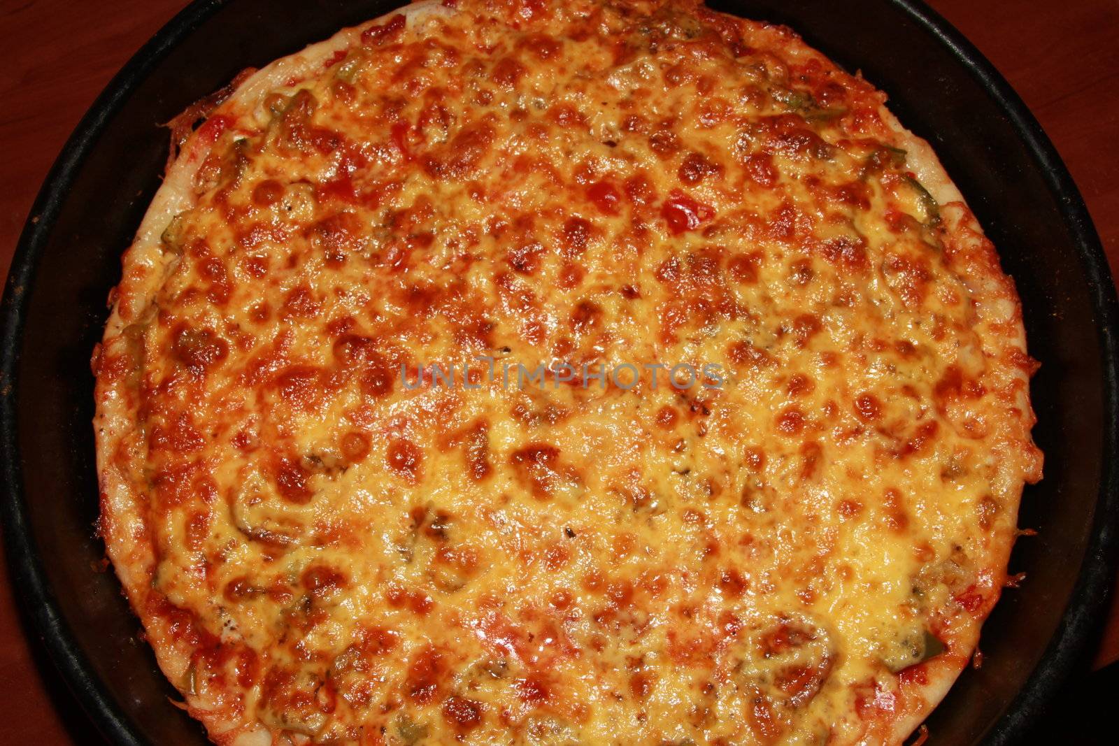 Appetizing pizza with a thick layer of cheese. pie