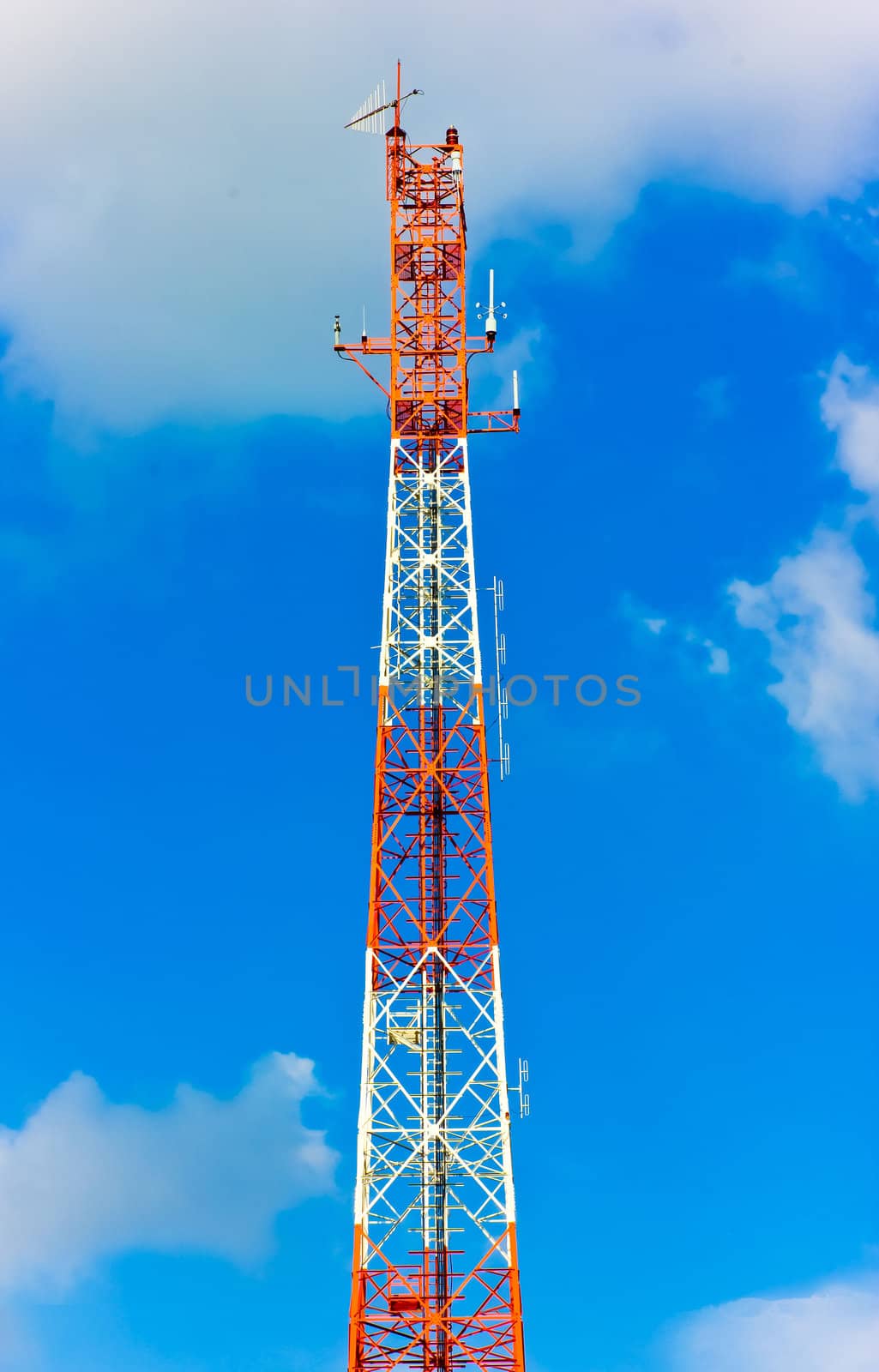 Radio tower and the blue sky and clouds by sutipp11