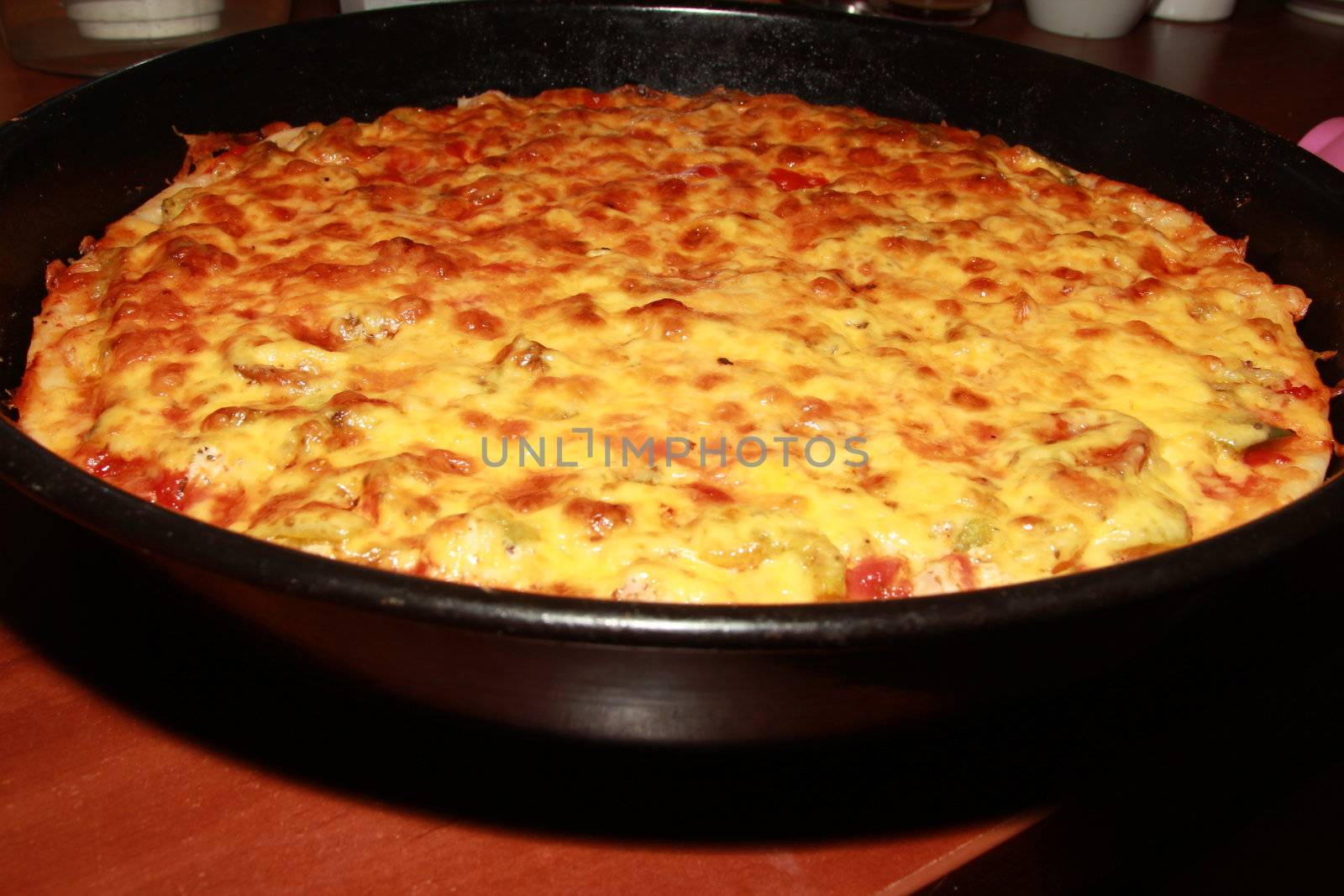 Appetizing pizza with a thick layer of cheese. pie