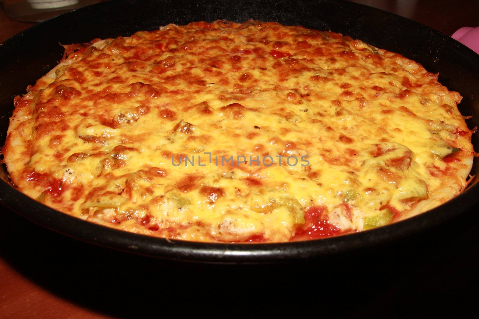 Appetizing pizza with a thick layer of cheese. pie