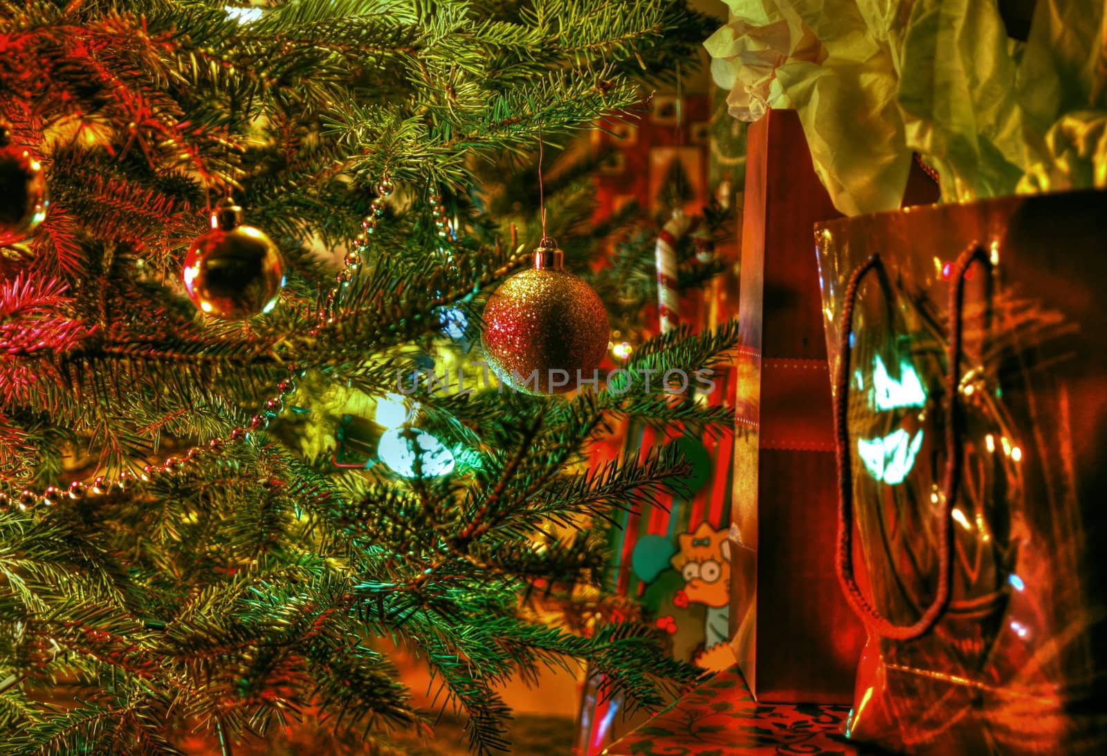 Wraped gifts under a Christmas tree and decorations