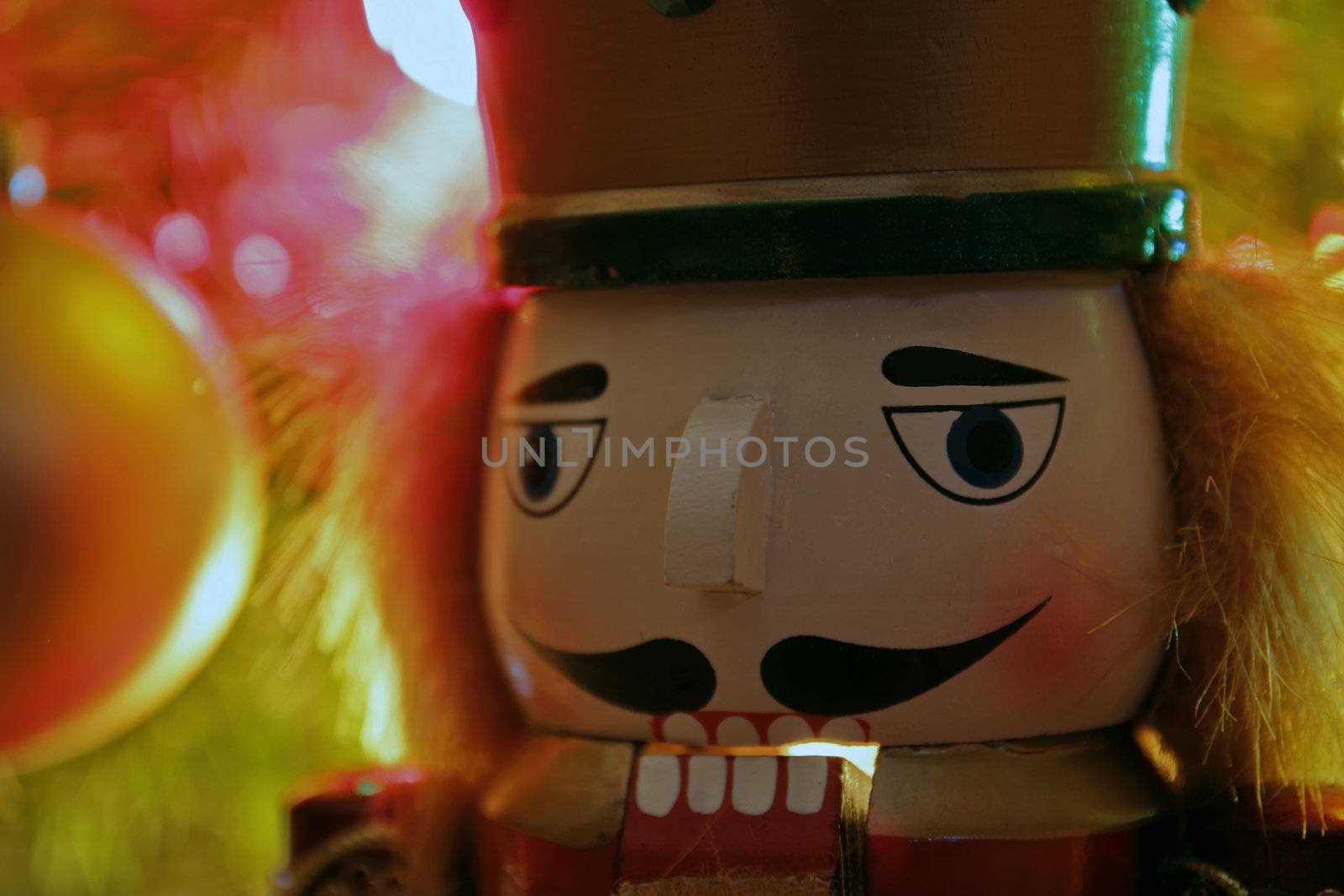 Close up view of Nutcracker in front of Christmas tree