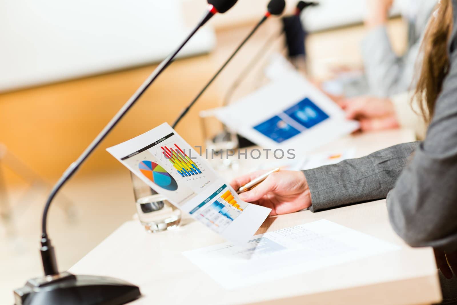 close-up microphone, on the background of business communication at the conference