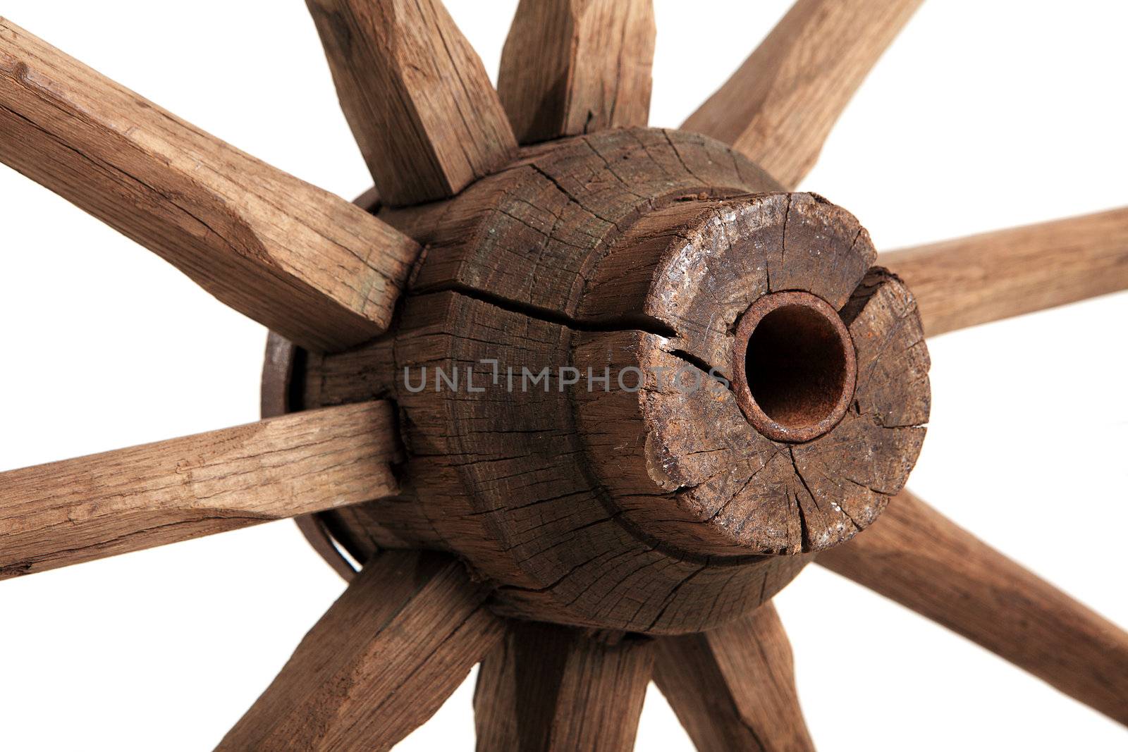 Old wooden wheel on the white background