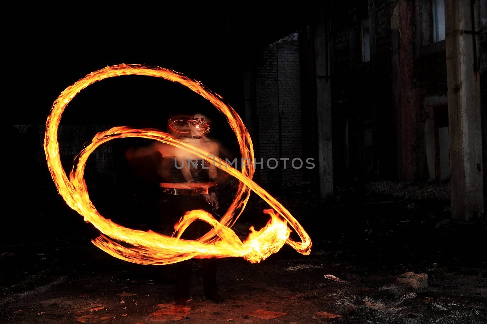 Woman holds in his hand the fire