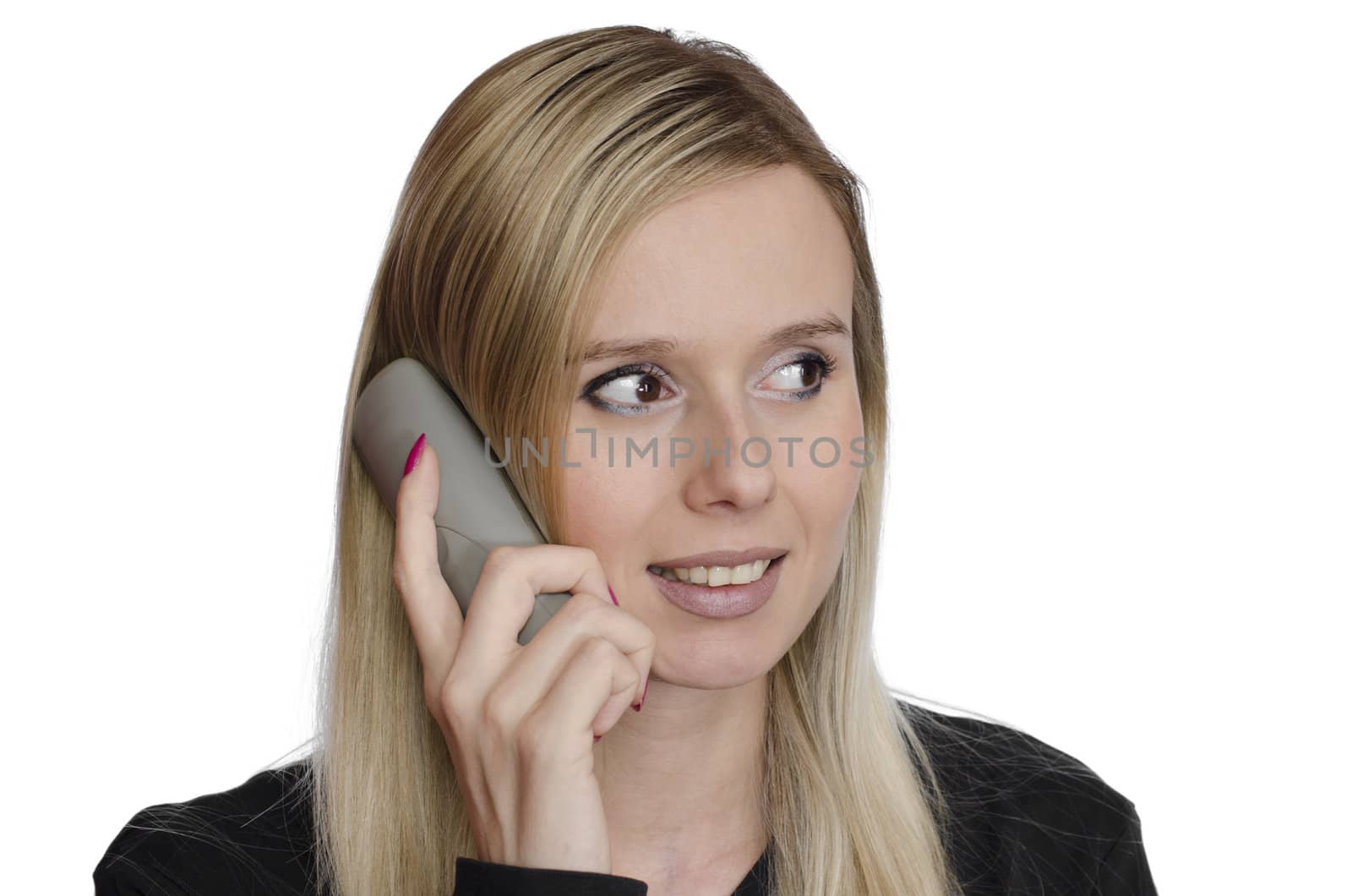young woman talking on the phone smiling on white background