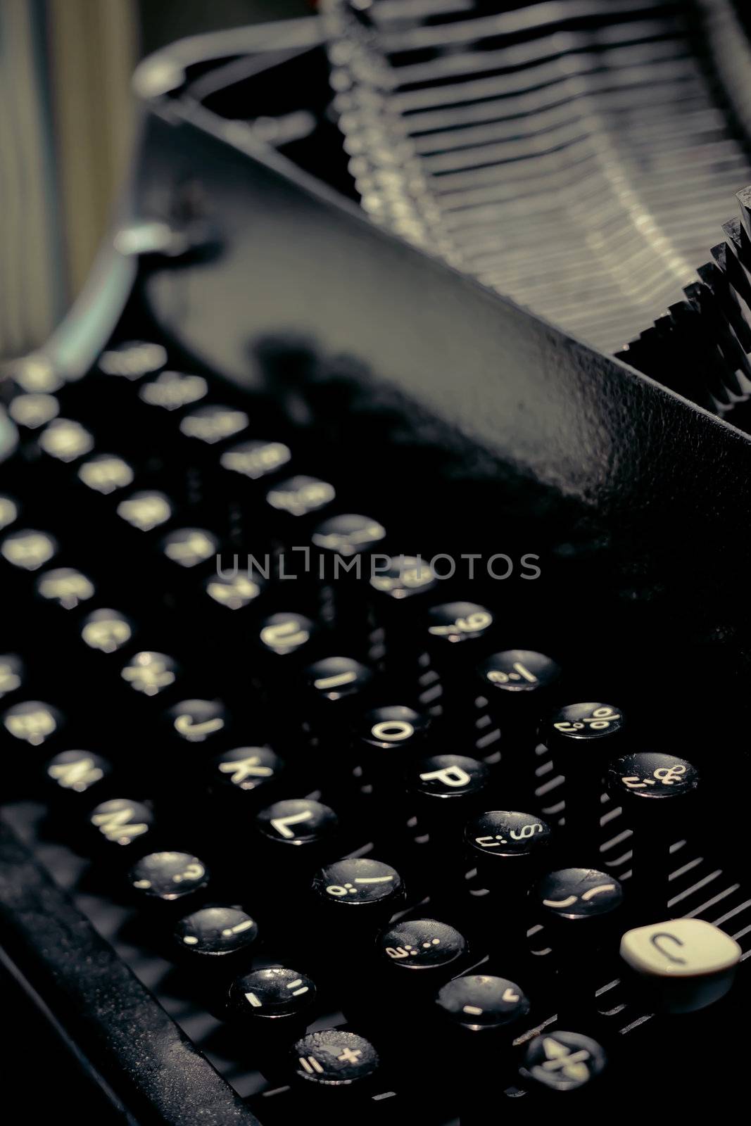 Antique typewriter keys close up selective focus with retro colors