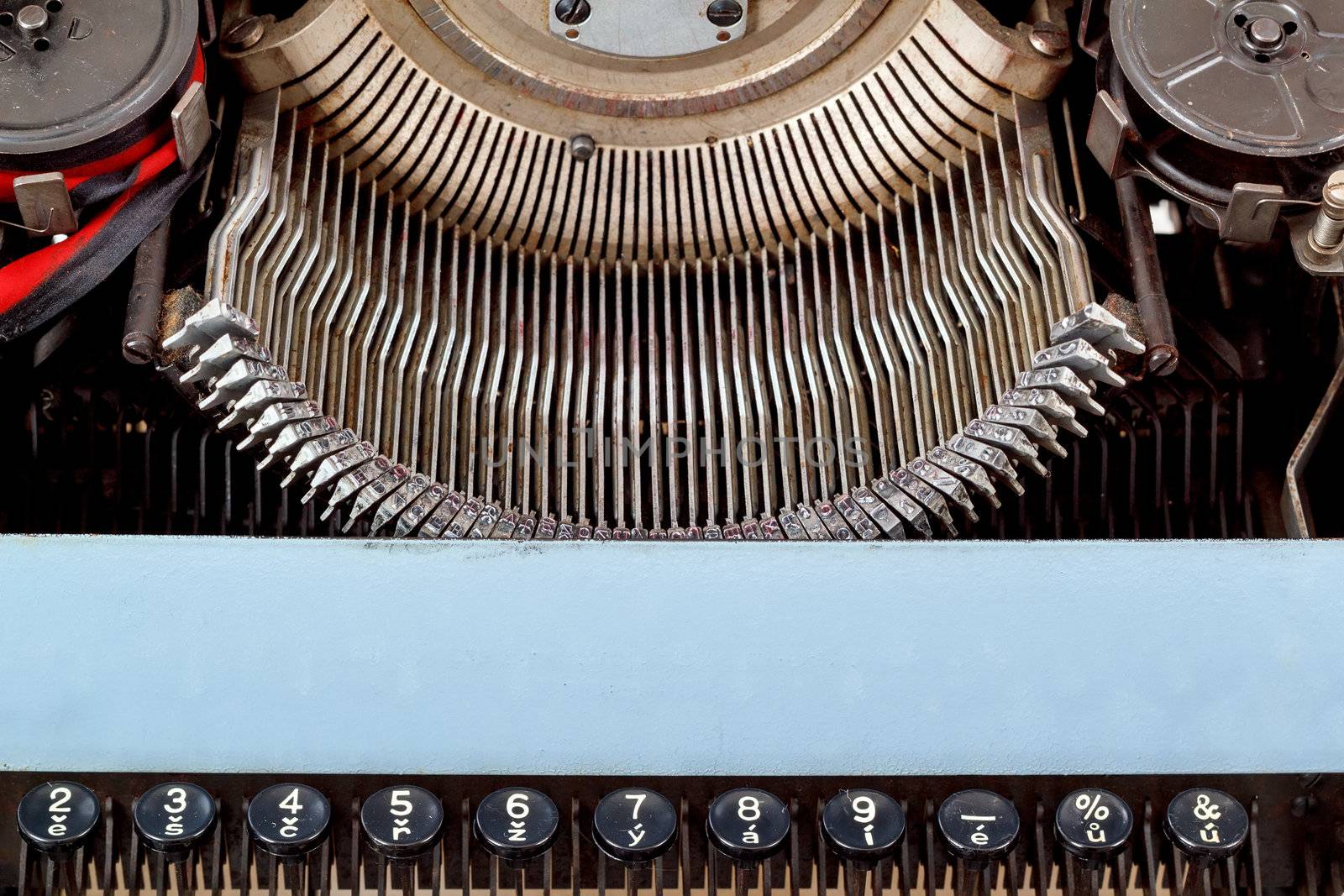 retro typewriter close up with number keys and letters mechanism